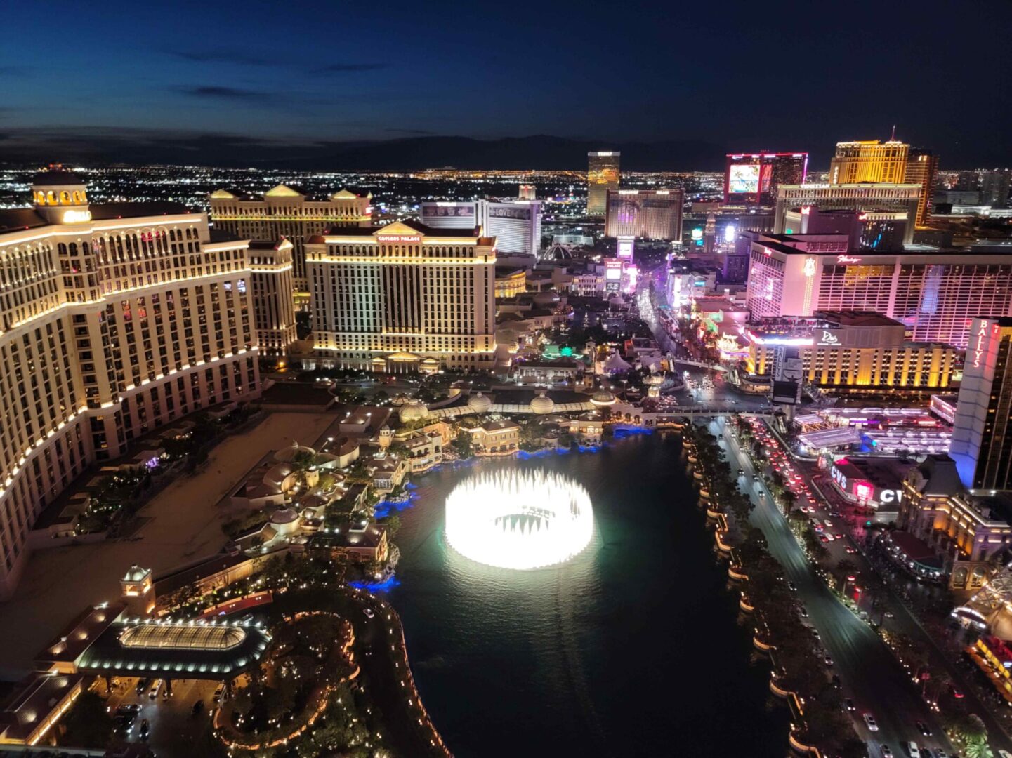 Las Vegas, Nevada - View of Bellagio Fountains at Night from Cosmopolitan Las Vegas 68th Floor Balcony