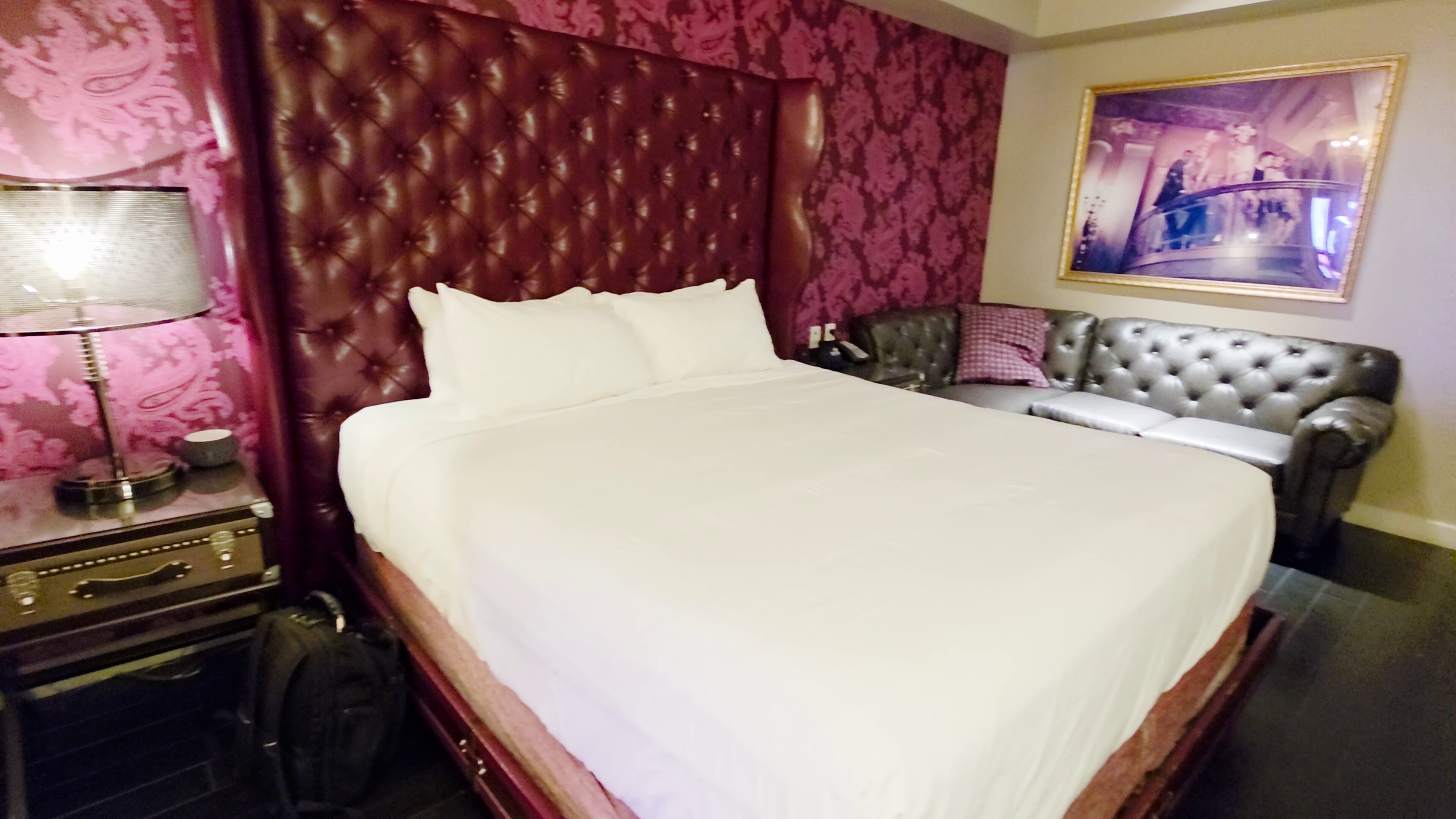 Vanderpump Hotel Las Vegas: Room Tour, Rates & Caesars Rewards 6 The Cromwell Las Vegas Classic King room interior with berry tones and warm wood floors
